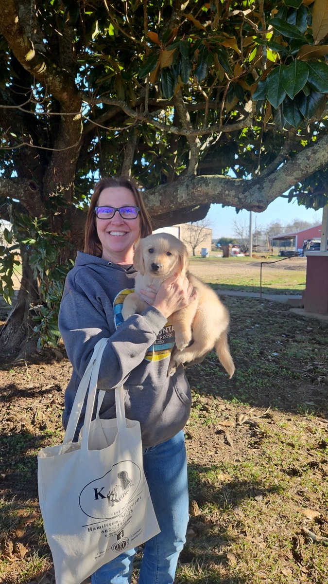 Tracie holding puppy Kaia