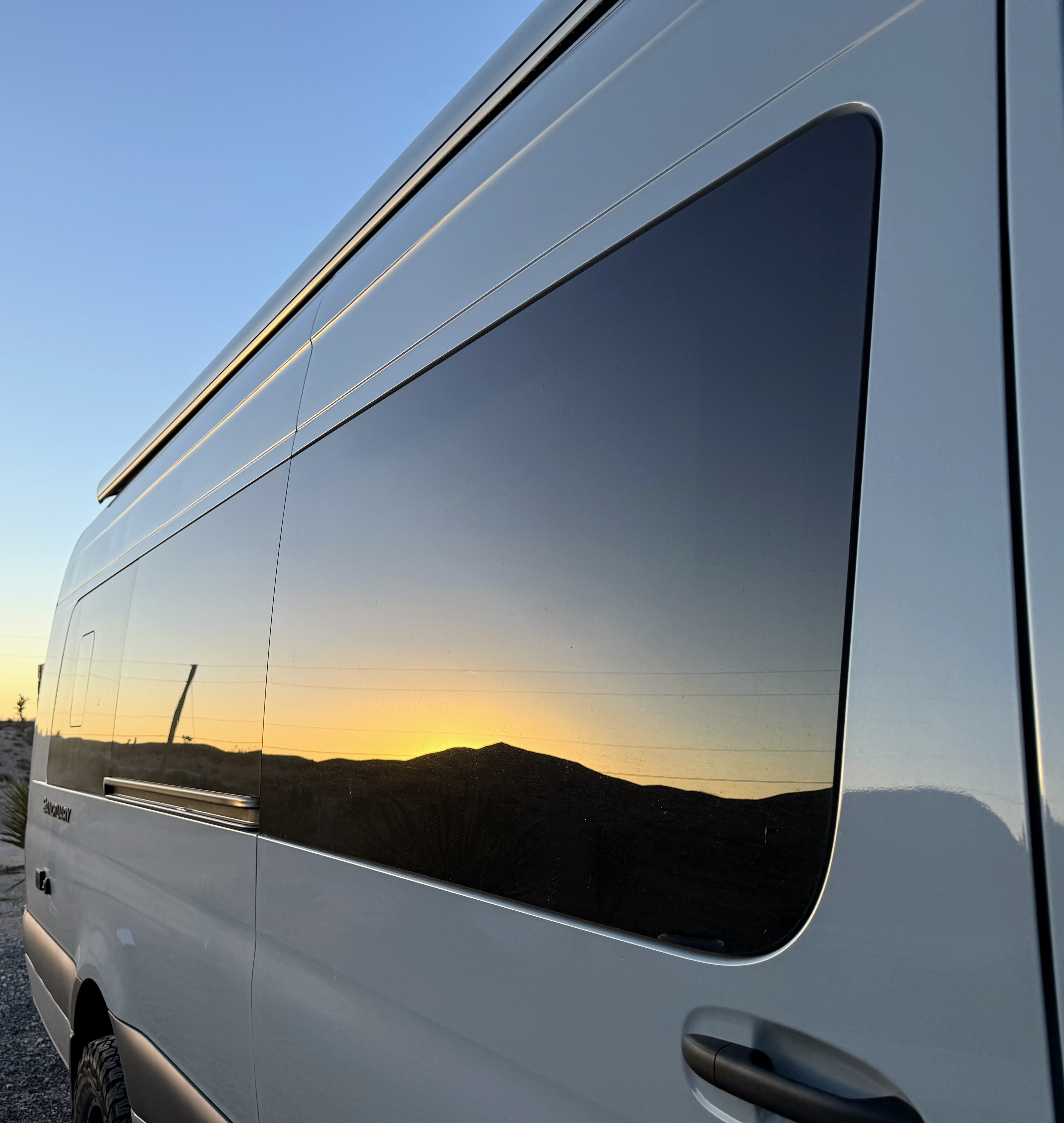 Desert sunset reflected in the van at Meadview, AZ