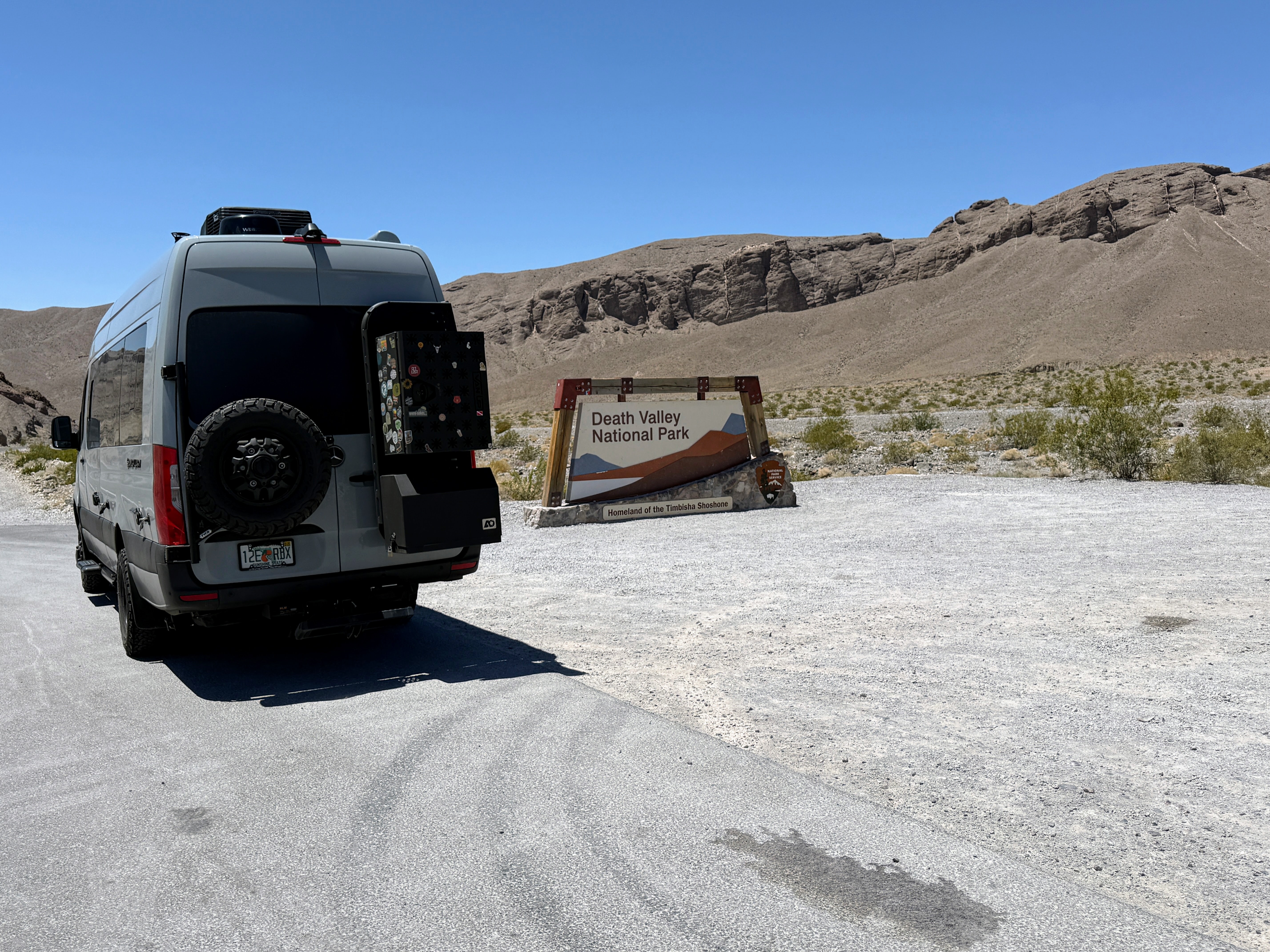 The van at the Death Valley National Park entrance sign