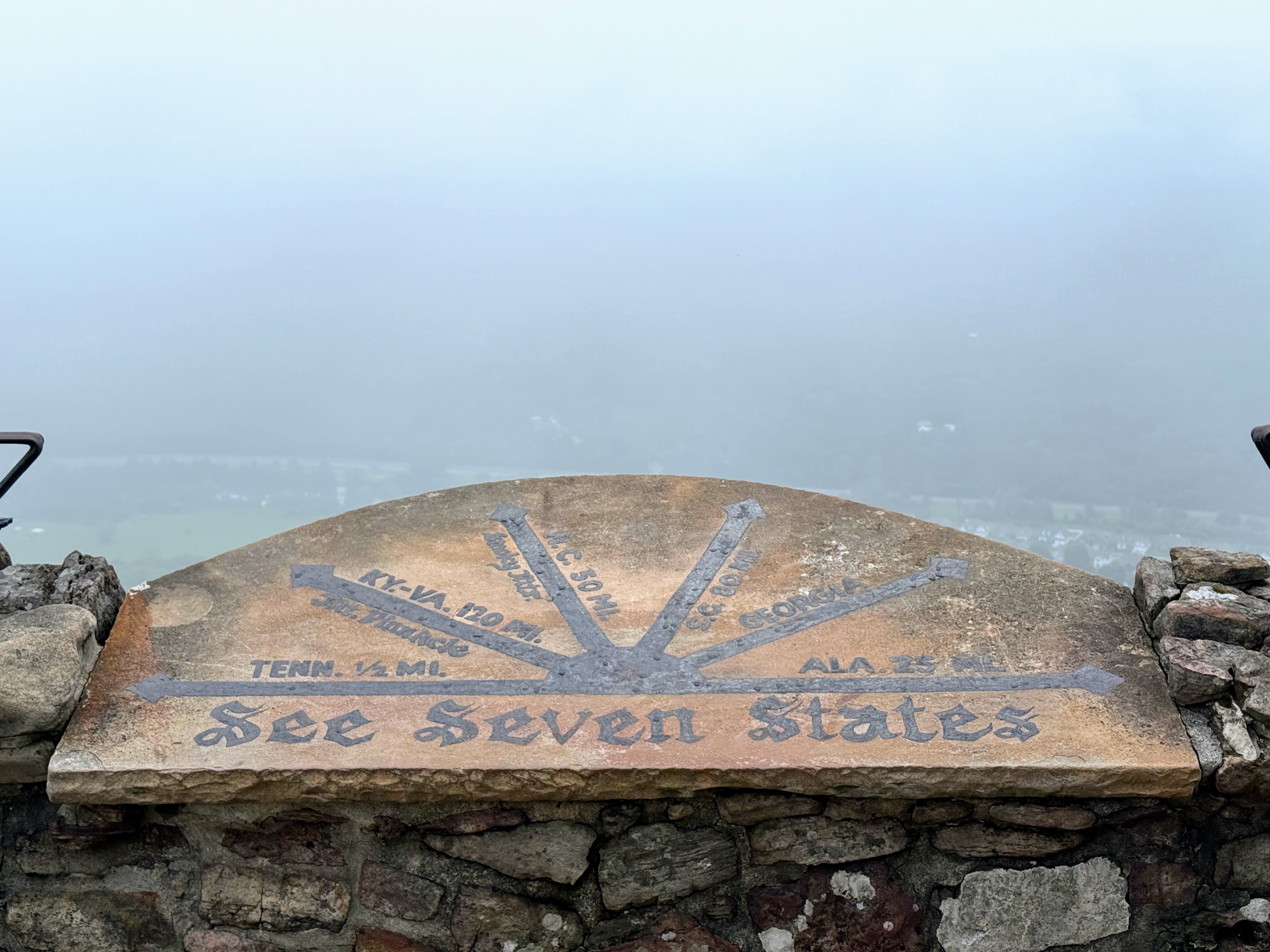 The 'See Seven States' overlook marker at Rock City Gardens