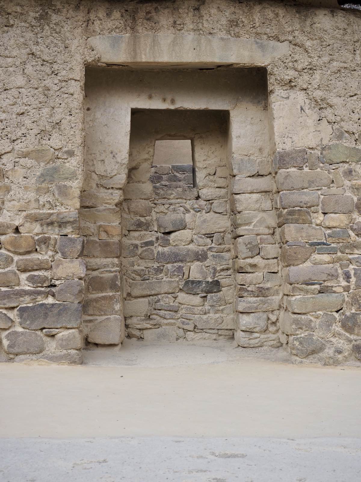 A stepped Inca doorway set into a stone wall