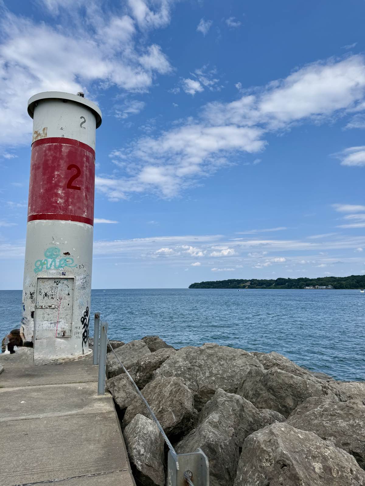 The beacon on the rocks where the bay lets out into the lake.
