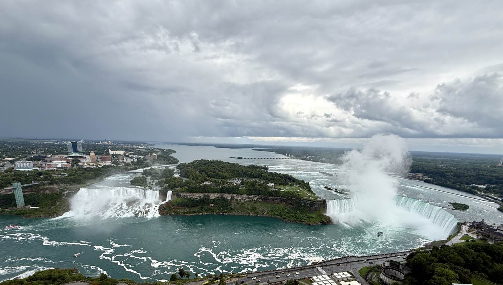 Horseshoe Falls seen from above, throwing up its own cloud of mist.